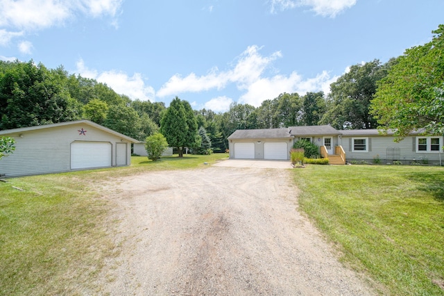 8756 Portage Lake Rd, Munith, MI 49259 - single story home with a garage, a front lawn, and driveway