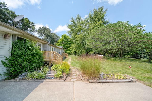 8756 Portage Lake Rd, Munith, MI 49259 - view of green lawn featuring a wooden deck and stairway