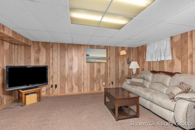 1060 Village Ln, Jenison, MI 49428 - carpeted living area with a drop ceiling and wood walls