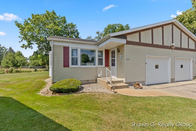 1060 Village Ln, Jenison, MI 49428 - view of front facade featuring a front yard and an attached garage