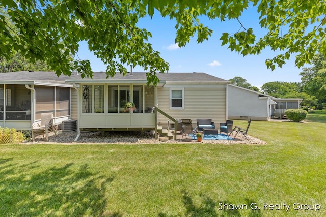 1060 Village Ln, Jenison, MI 49428 - back of property with a sunroom, a yard, outdoor lounge area, and a patio