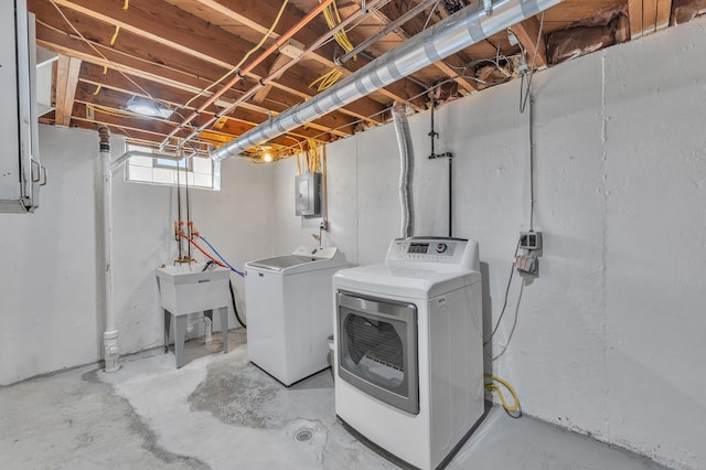 9623 Fairfield St, Livonia, MI 48150 - laundry area featuring washing machine and dryer and electric panel