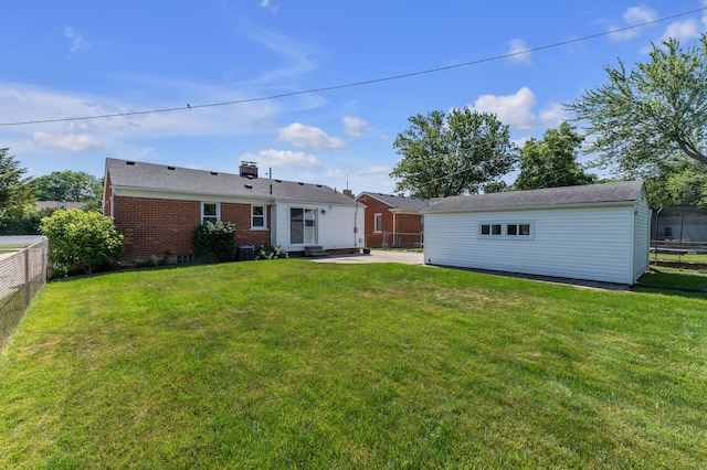 9623 Fairfield St, Livonia, MI 48150 - back of property with a fenced backyard, brick siding, entry steps, a patio area, and a chimney