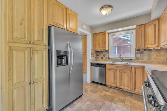 9623 Fairfield St, Livonia, MI 48150 - kitchen featuring stainless steel appliances, backsplash, light countertops, and light stone finish flooring