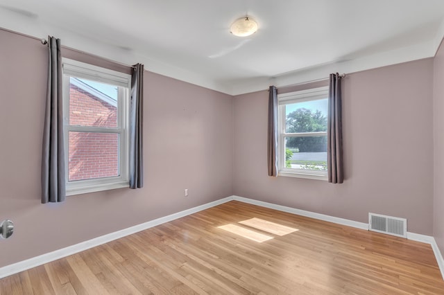 9623 Fairfield St, Livonia, MI 48150 - unfurnished room featuring plenty of natural light and wood finished floors