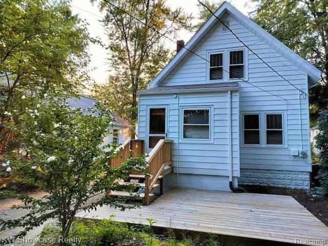 1828 N Lafayette Ave, Royal Oak, MI 48073 - rear view of house featuring a deck and a chimney