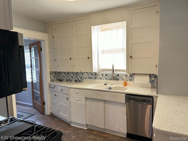 1828 N Lafayette Ave, Royal Oak, MI 48073 - kitchen with stainless steel dishwasher, backsplash, white cabinetry, and range