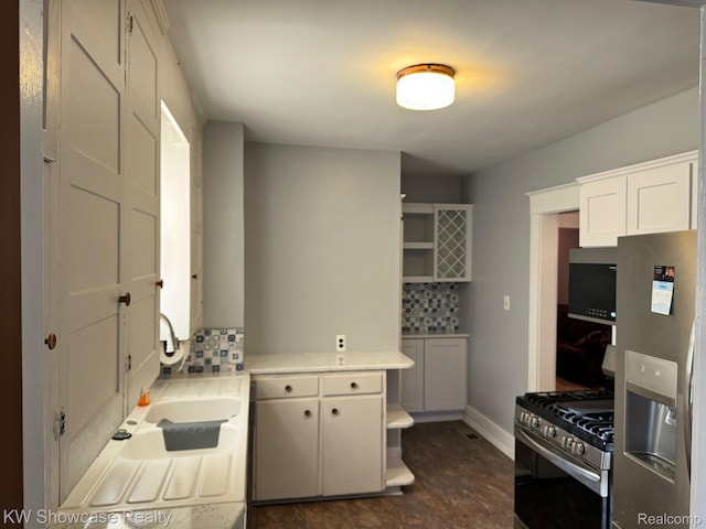 1828 N Lafayette Ave, Royal Oak, MI 48073 - kitchen featuring appliances with stainless steel finishes, tasteful backsplash, light countertops, and white cabinets