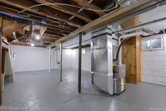1828 N Lafayette Ave, Royal Oak, MI 48073 - basement featuring heating unit and concrete block wall
