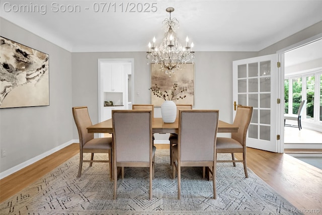 425 Fairfax St, Birmingham, MI 48009 - dining area featuring light wood-style floors and a chandelier