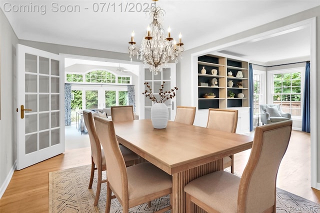 425 Fairfax St, Birmingham, MI 48009 - dining area with a chandelier and light wood-style floors