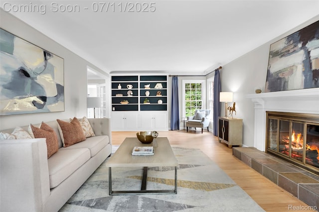 425 Fairfax St, Birmingham, MI 48009 - living room featuring wood finished floors and a tile fireplace