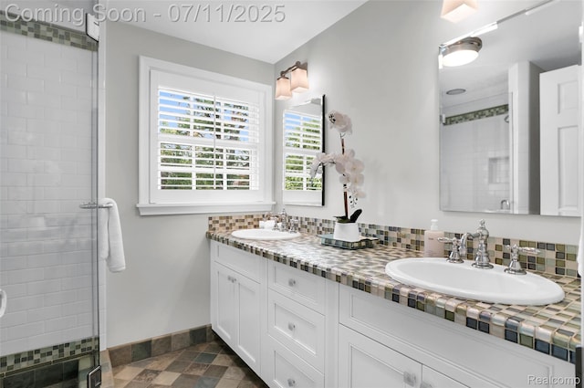 425 Fairfax St, Birmingham, MI 48009 - full bathroom with double vanity, a tile shower, and backsplash