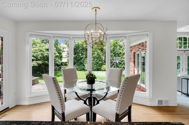 425 Fairfax St, Birmingham, MI 48009 - dining area featuring a chandelier and wood finished floors