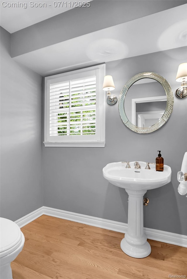 425 Fairfax St, Birmingham, MI 48009 - bathroom featuring wood finished floors and baseboards