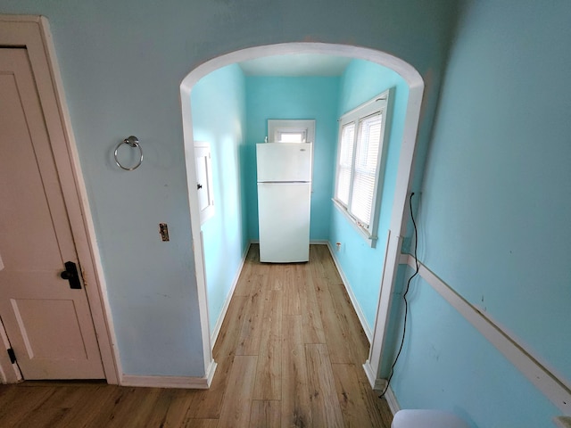 1110 Watkins St SE, Grand Rapids, MI 49507 - hallway with arched walkways and light wood-style flooring