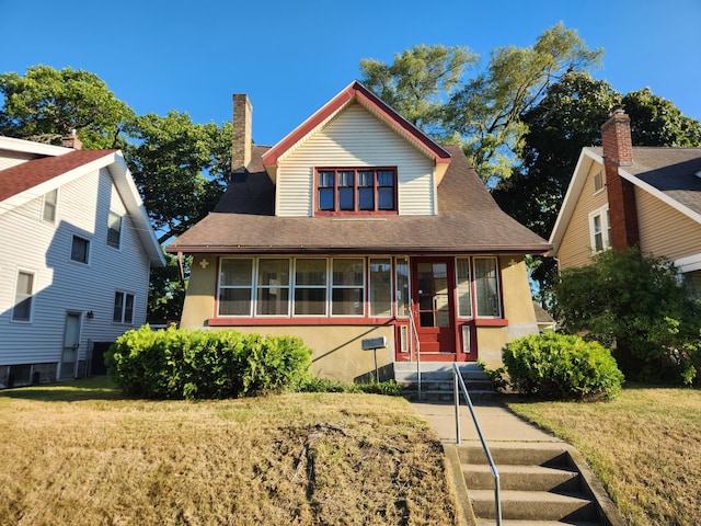 1110 Watkins St SE, Grand Rapids, MI 49507 - bungalow-style house with stucco siding, a front yard, a chimney, and entry steps