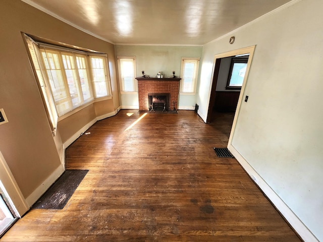 1110 Watkins St SE, Grand Rapids, MI 49507 - unfurnished living room featuring crown molding, a fireplace, and hardwood / wood-style floors