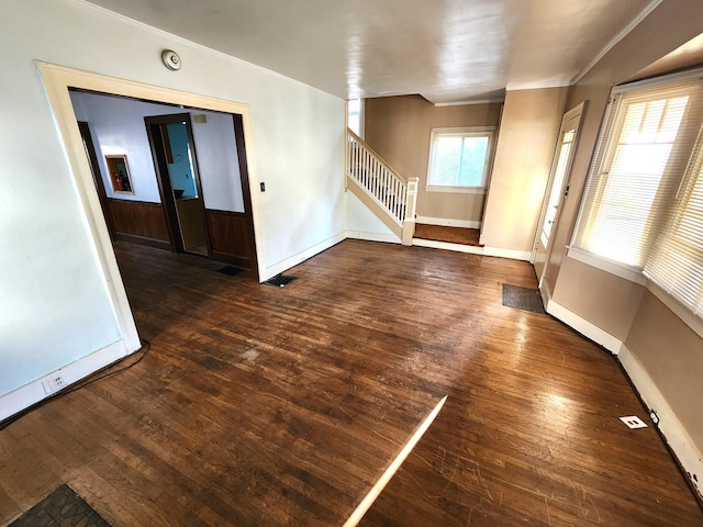 1110 Watkins St SE, Grand Rapids, MI 49507 - spare room featuring hardwood / wood-style floors, crown molding, and stairway