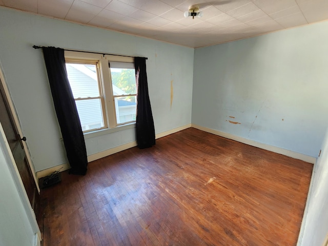 1110 Watkins St SE, Grand Rapids, MI 49507 - spare room with hardwood / wood-style flooring and baseboards