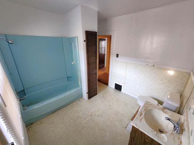 1110 Watkins St SE, Grand Rapids, MI 49507 - full bathroom featuring tile patterned floors, vanity, and bathing tub / shower combination