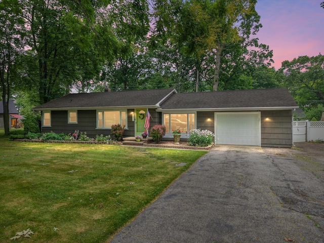 5674 Brunswick Blvd, Waterford, MI 48327 - ranch-style house featuring an attached garage and driveway