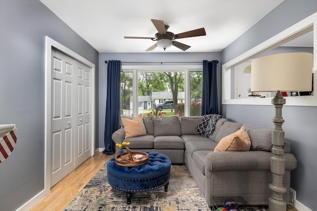 5674 Brunswick Blvd, Waterford, MI 48327 - living room featuring ceiling fan and light wood-type flooring