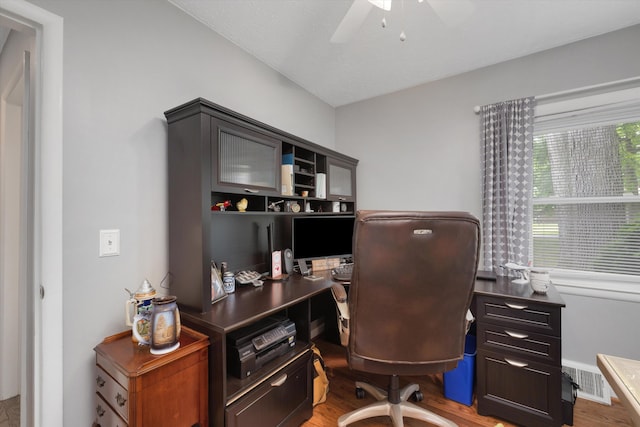 5674 Brunswick Blvd, Waterford, MI 48327 - home office featuring a ceiling fan and wood finished floors