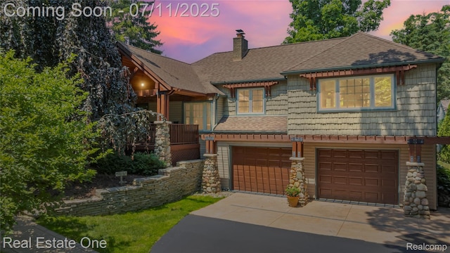 25740 Farmbrook Rd, Southfield, MI 48034 - view of front of home featuring concrete driveway, an attached garage, a chimney, and roof with shingles