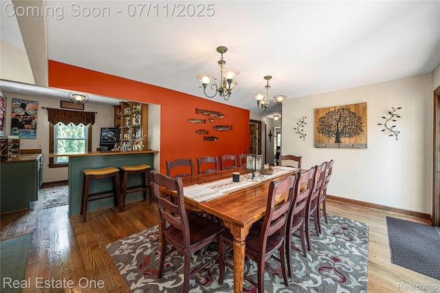 25740 Farmbrook Rd, Southfield, MI 48034 - dining area featuring a chandelier and wood finished floors