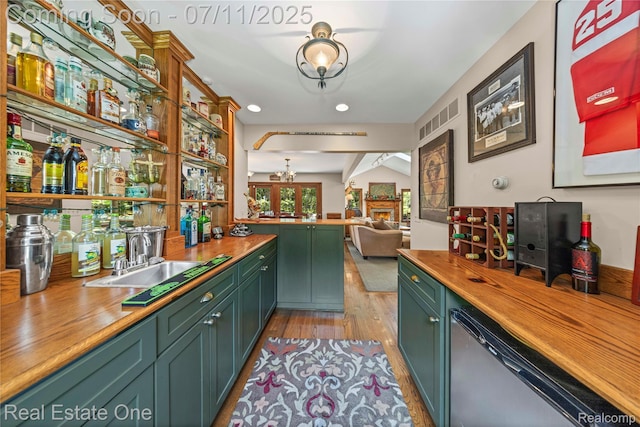 25740 Farmbrook Rd, Southfield, MI 48034 - indoor bar with a chandelier, light wood-style flooring, dishwasher, and recessed lighting