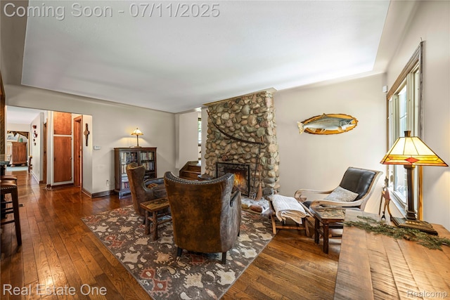 25740 Farmbrook Rd, Southfield, MI 48034 - living area featuring hardwood / wood-style floors and a stone fireplace