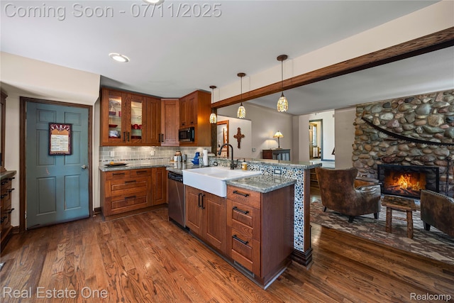 25740 Farmbrook Rd, Southfield, MI 48034 - kitchen with stainless steel appliances, open floor plan, dark wood finished floors, and brown cabinets