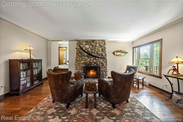 25740 Farmbrook Rd, Southfield, MI 48034 - living area featuring wood-type flooring, a stone fireplace, and crown molding