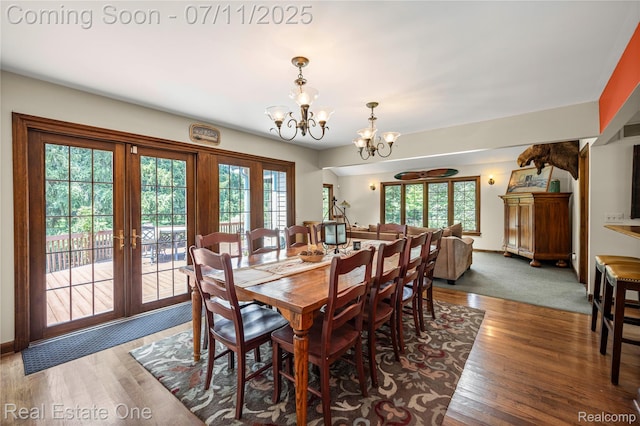 25740 Farmbrook Rd, Southfield, MI 48034 - dining space with a chandelier, french doors, and wood finished floors