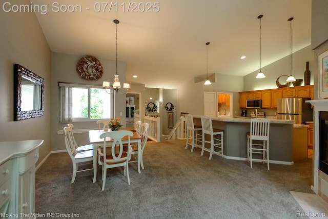 61001 Evergreen Ct, South Lyon, MI 48178 - dining room featuring carpet flooring, a fireplace with flush hearth, vaulted ceiling, a chandelier, and recessed lighting