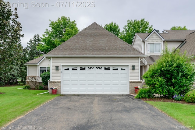 61001 Evergreen Ct, South Lyon, MI 48178 - view of front of house with driveway, brick siding, a front lawn, a garage, and roof with shingles
