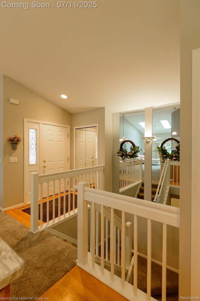 61001 Evergreen Ct, South Lyon, MI 48178 - corridor featuring an upstairs landing, wood finished floors, and recessed lighting