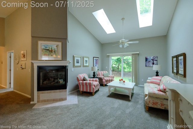 61001 Evergreen Ct, South Lyon, MI 48178 - carpeted living area featuring high vaulted ceiling, a fireplace with flush hearth, and a skylight