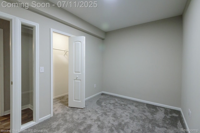 61001 Evergreen Ct, South Lyon, MI 48178 - unfurnished bedroom featuring carpet and baseboards