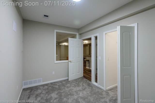 61001 Evergreen Ct, South Lyon, MI 48178 - unfurnished bedroom featuring carpet and baseboards