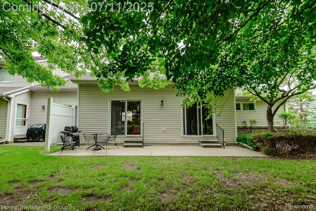 61001 Evergreen Ct, South Lyon, MI 48178 - rear view of property with a yard, a patio area, and entry steps
