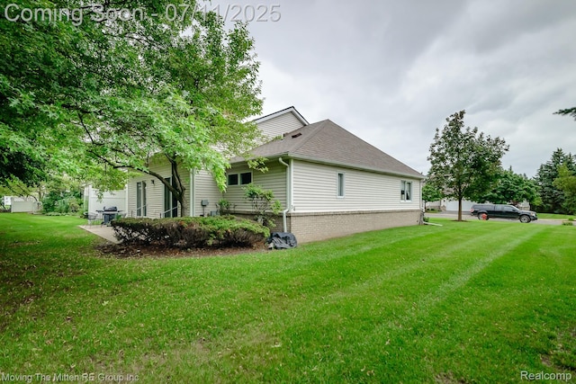 61001 Evergreen Ct, South Lyon, MI 48178 - view of property exterior with a lawn and roof with shingles