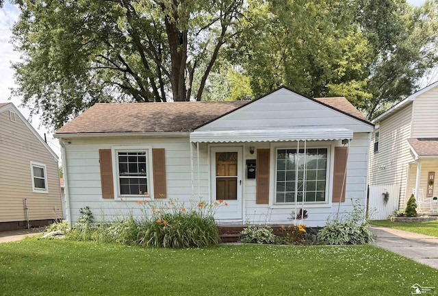 6114 Hazel St, Taylor, MI 48180 - view of front of property featuring a front lawn and a shingled roof