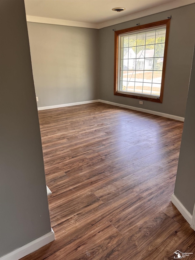 6114 Hazel St, Taylor, MI 48180 - empty room with dark wood-style floors