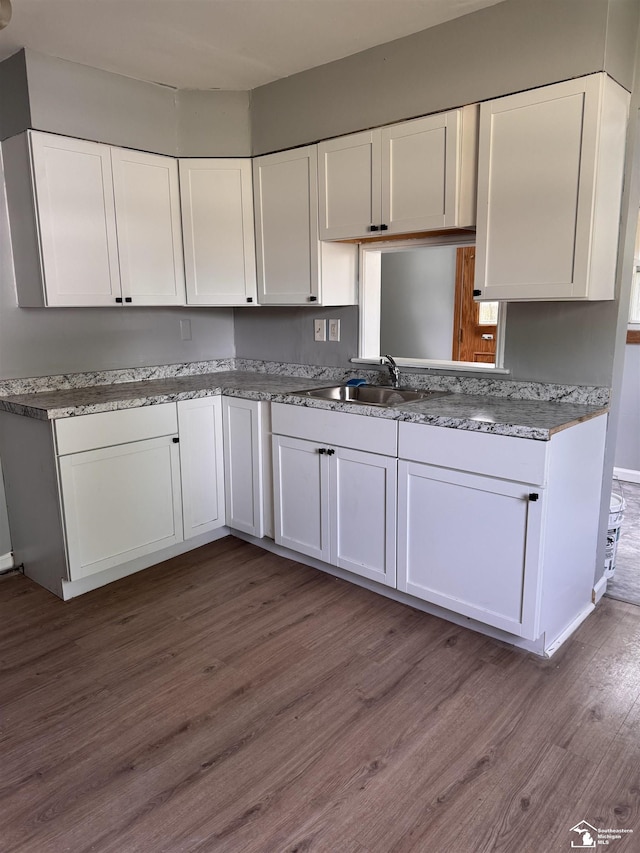 6114 Hazel St, Taylor, MI 48180 - kitchen featuring white cabinetry and dark wood-style flooring