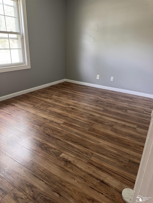 6114 Hazel St, Taylor, MI 48180 - unfurnished room with dark wood-style floors and baseboards