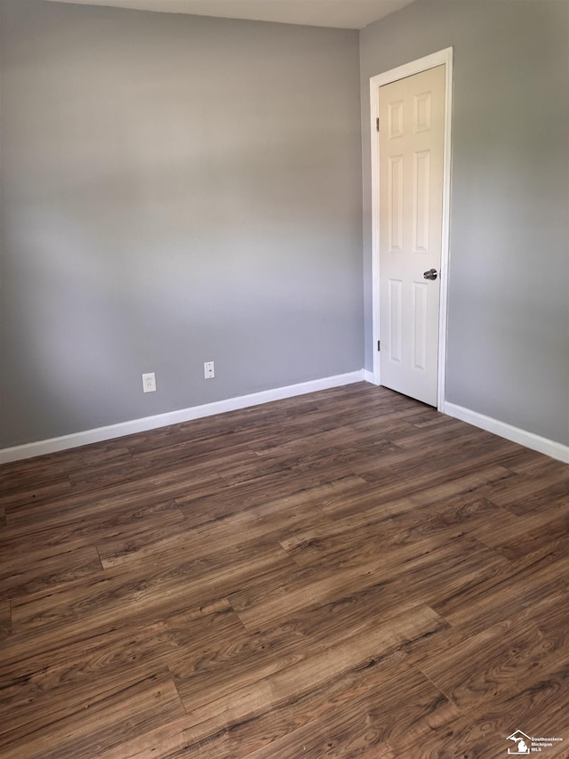 6114 Hazel St, Taylor, MI 48180 - unfurnished room featuring baseboards and dark wood-style floors