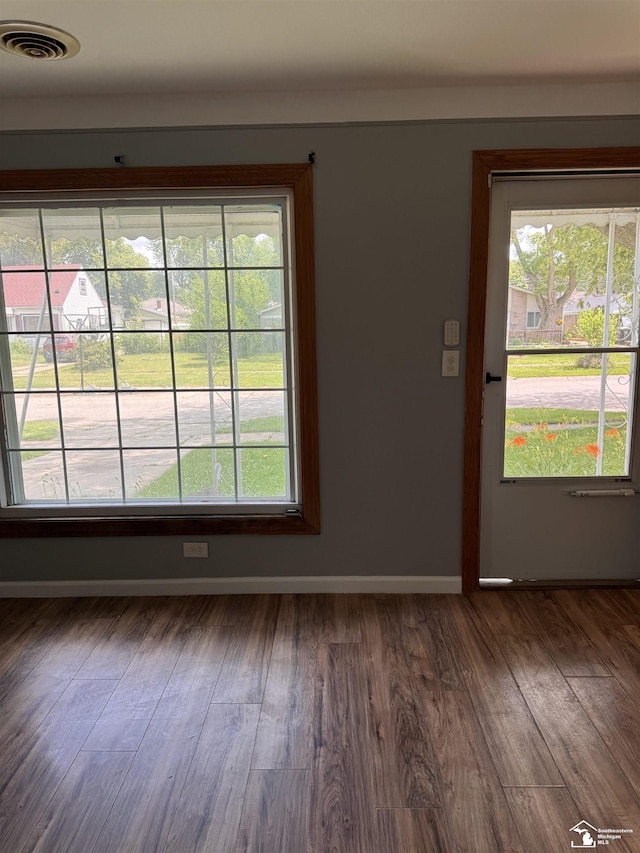 6114 Hazel St, Taylor, MI 48180 - unfurnished room with healthy amount of natural light and wood finished floors