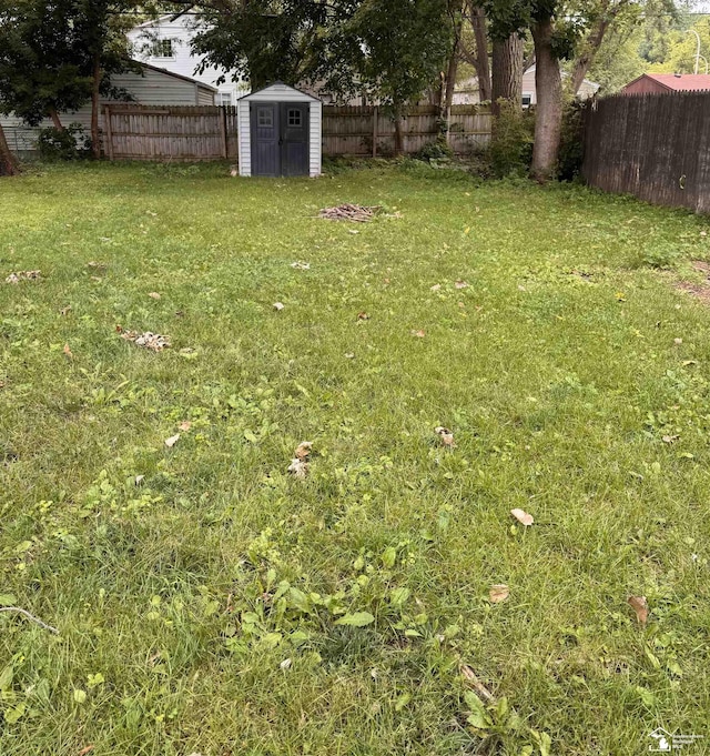 6114 Hazel St, Taylor, MI 48180 - fenced backyard featuring a storage shed